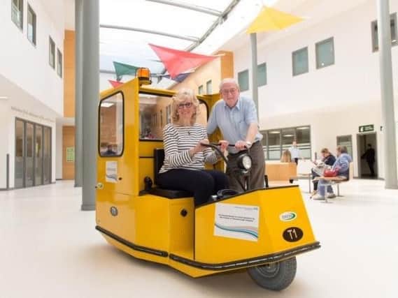 Pictured volunteers at Peterborough Hospital on a replica buggy, which NGH is fundraising for. NGH would, however, like their buggy to be white and will brand it with the fundraisers names.