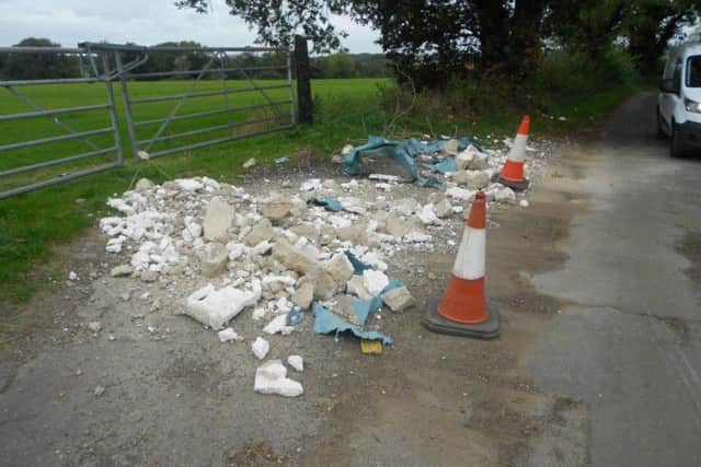 The rubble after is was swept to the side of the road by a council clean-up team