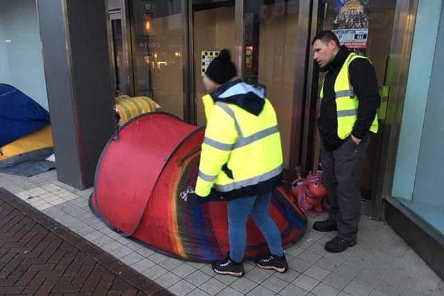 Outreach workers Mandy and Michael talk to a rough sleeper in Abington Street.