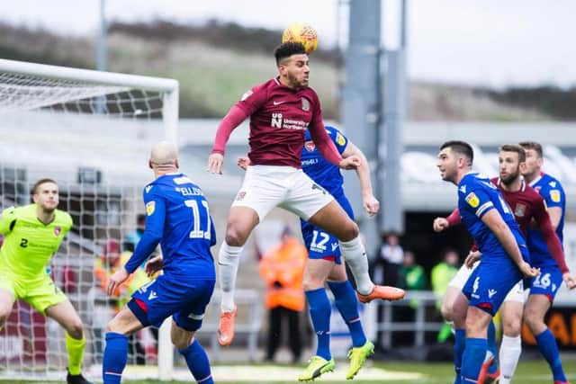 Daniel Powell flicks the ball on during the Cobblers' 1-1 draw with Morecambe on Saturday (Pictures: Kirsty Edmonds)
