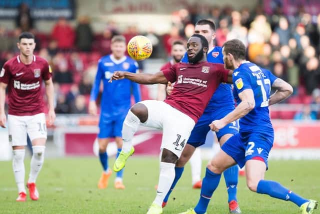 Junior Morias battles for possession