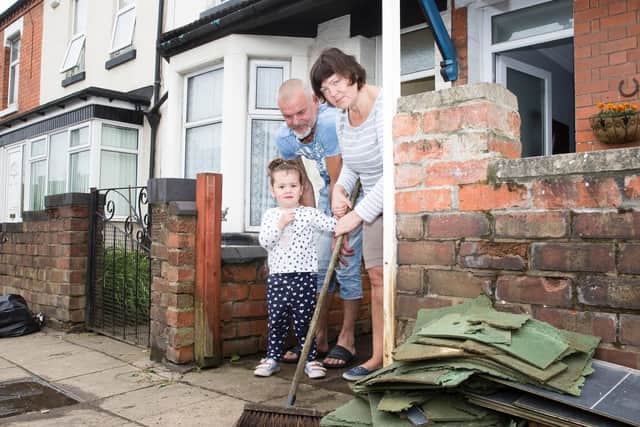 Dozens of homes and businesses were damaged by the filthy flood water.