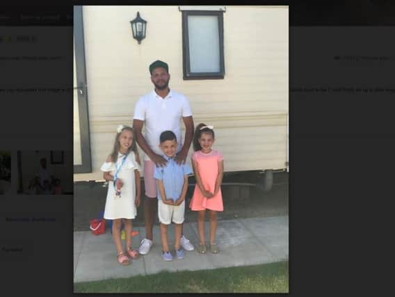 Jermaine Jones (pictured recently with his children) is looking for the teacher who took him in after a fire in 1991.