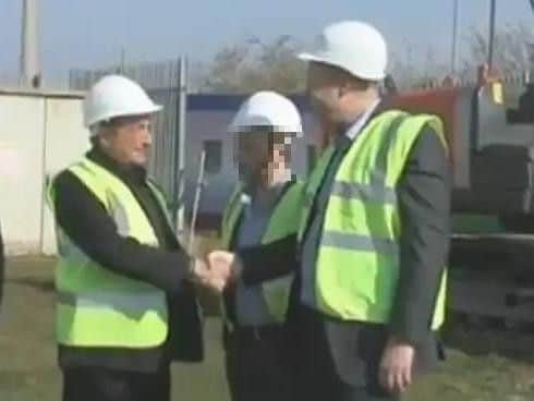 Howard Grossman, left, shakes hands with former Northampton Town chairman, David Cardoza, at a ceremony to mark the start of work on the East Stand in March 2014