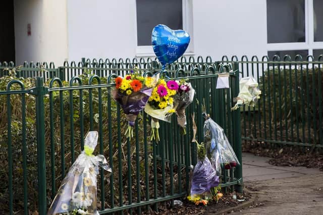 Seven bunches of flowers and a heart-shaped blue balloon were left by the railings where the incident took place.