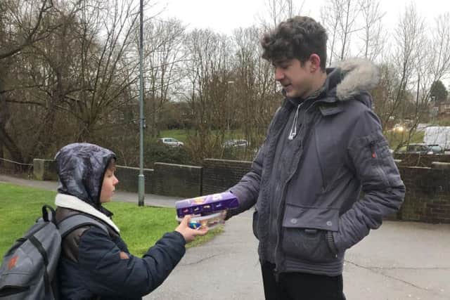 Young Charlie Johnson pictured giving Nathaniel Clarke his thank you presents.