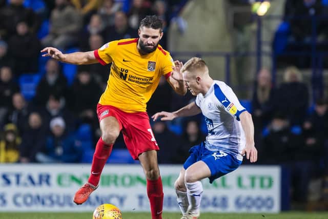 Jordan Turnbull battles for the ball