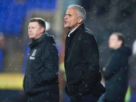 Keith Curle watched his Cobblers team claim a crucial 2-1 win at Tranmere on Tuesday night (Picture: Kirsty Edmonds)