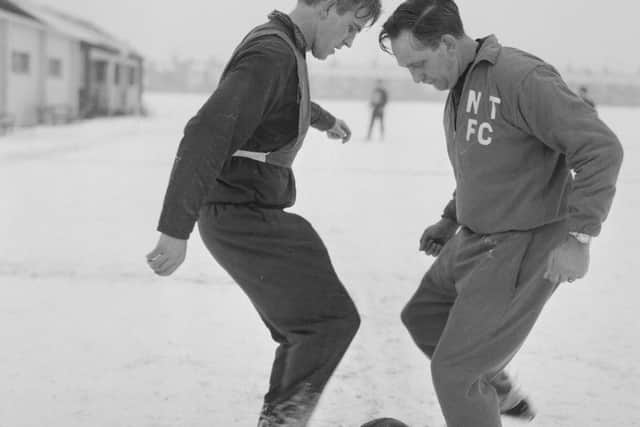 Dave Bowen (right) coaches Graham Moore at a snowy Old Northamptonians sports ground