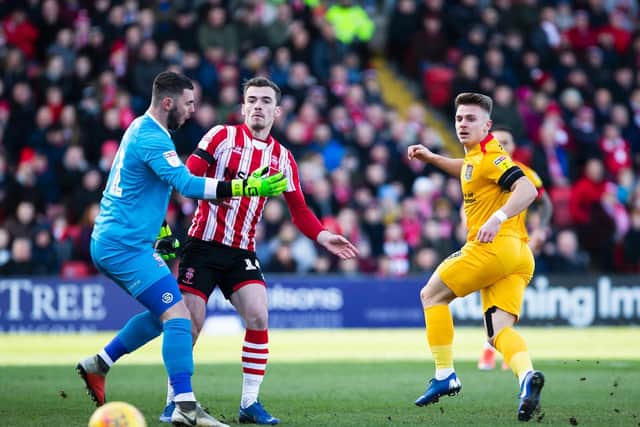 Sam Hoskins almost had this early chance to put Cobblers ahead at Sincil Bank. Pictures: Kirsty Edmonds