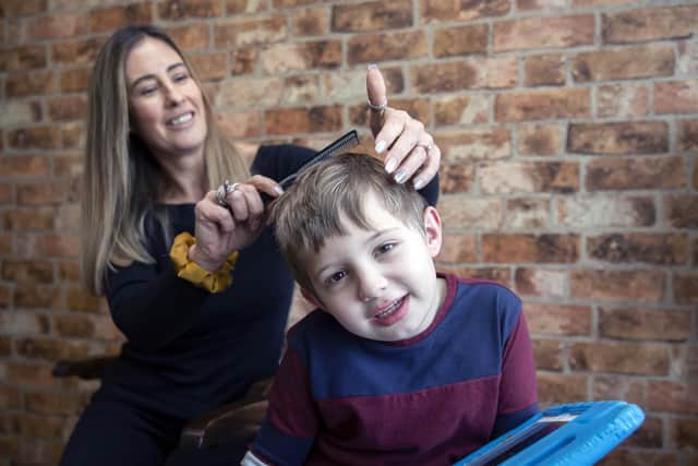 Charlie Browns Gentleman's Barbers is an autism-friendly barbers where little Alfie is pictured getting his haircut by Charlie.