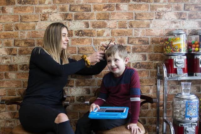 Charlie lets the children feel really comfortable in her salon and cuts their hair where the little ones prefer to sit.