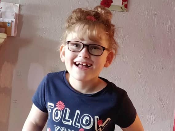 Kayla, 8, is fundraising for an operation which will help her walk again.