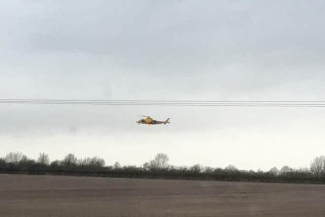The Air Ambulance landing nearby at the scene