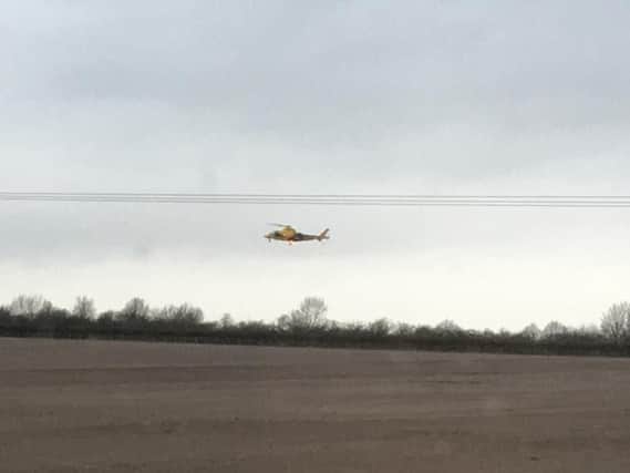 The Air Ambulance landing nearby at the scene