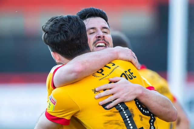You beauty! David Buchanan and Jack Bridge celebrate Town's late win at Stevenage.