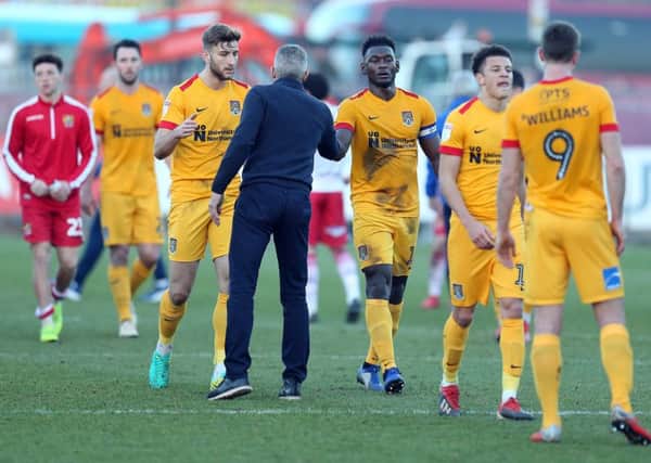 Keith Curle congratulates his players after their victory at Stevenage on Saturday. Picture: Pete Norton/Getty Images