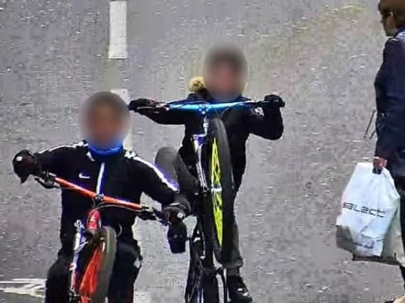 Teenagers riding bikes through town in front of cars and buses has become a daily problem.