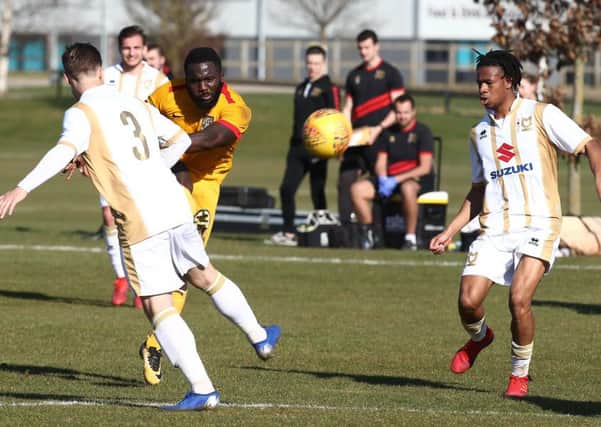 Junior Morias gets a shot away during the Cobblers Reserves' draw with Milton Keynes on Tuesday (Pictures: Pete Norton)