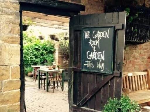 The Althorp Coaching Inn in Great Brington is as cosy outside in the summer as it is inside in the winter with its beautiful enclosed courtyard garden