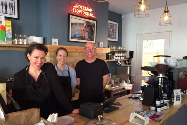 Manager Angelina Pretty, barrista Katie Haji-Miller and owner Liam Cahill behind their new counter.