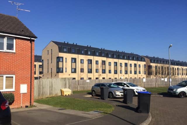 The end of Malt House Close is seperated from the university by a wooden fence. Beyond is a student halls complex for some 1,300 people.
