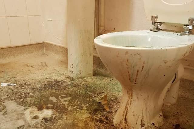 The bathroom was in a state of disrepair.
