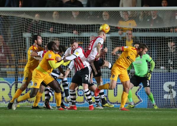 Andy Williams tried to claim Northampton's late equaliser at Exeter as his own, but it went down as a Jayden Stockley own goal. Picture: Pete Norton/Getty Images