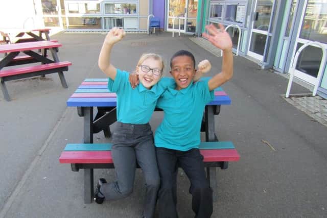 Castle Academy pupils Emily Dale and Jordan Hounsou celebrate the schools fantastic results.