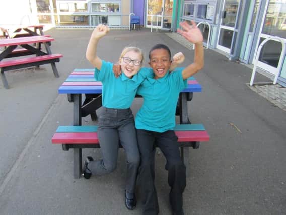Castle Academy pupils Emily Dale and Jordan Hounsou celebrate the schools fantastic results.