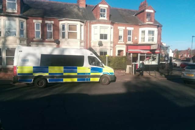 A police van was parked outside the Giggling Sausage Cafe