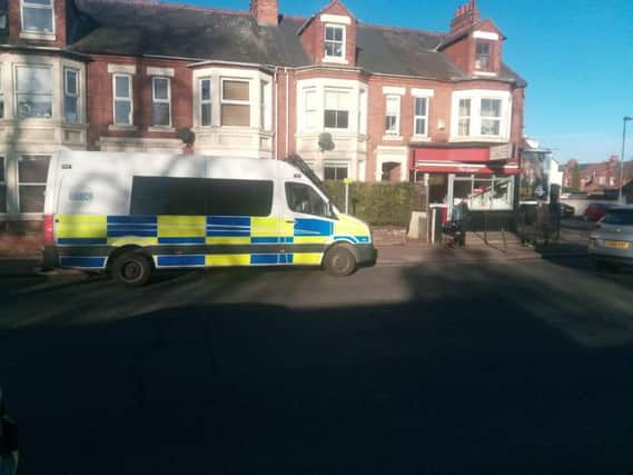 A police van was parked outside the Giggling Sausage Cafe