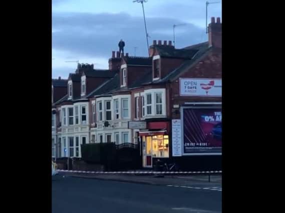 A man was seen on the roofs of houses in London Road this morning