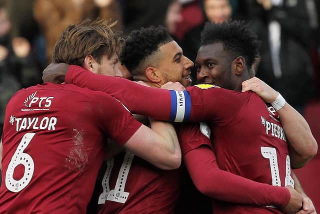 TWO TO THE GOOD! Cobblers celebrate their second goal against Exeter. Pictures: Sharon Lucey