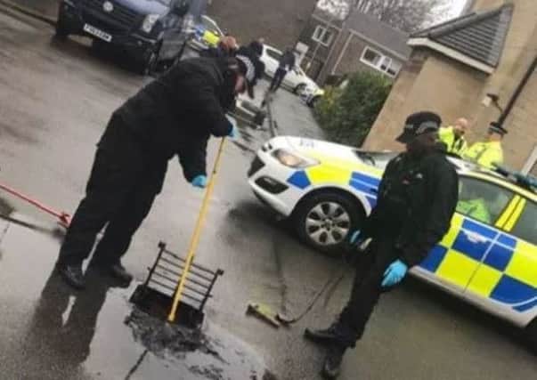 A drain is searched following the shooting over Christmas NNL-190221-140655005 NNL-190221-140655005