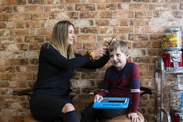 Charlie Browns Gentleman's Barbers is an autism-friendly barbers where little Alfie is pictured getting his haircut by Charlie.