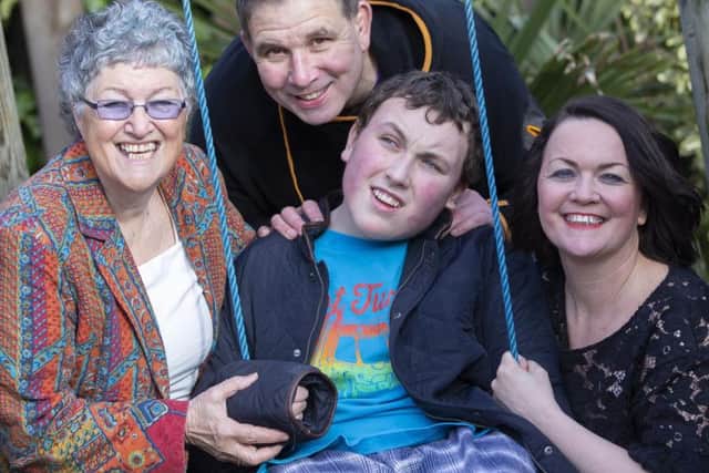 Lloyd (centre) with grandma Irene, dad Stuart and mum Julie.