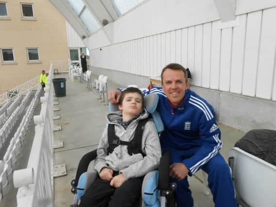 Lewis pictured with former England cricketer, Graeme Swann who was born in Northampton and went on to attend Sponne School in Towcester.