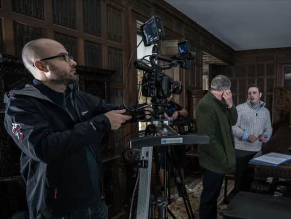 This picture shows the crew filming behind the scenes at Abington Park Museum. They were taken with the exhibits and it's old manor house feel.