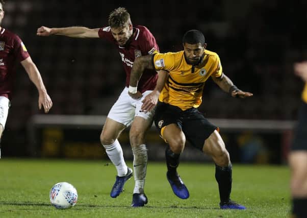 Sam Foley battles for the ball with Newport's Josh Labadie (Photo by Pete Norton/Getty Images)