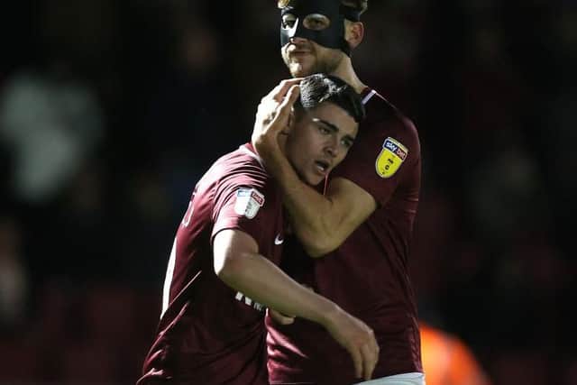 Nice one, Joe! Charlie Goode congratulates match-winner Joe Powell after his stunning goal on Tuesday. Picture: Pete Norton