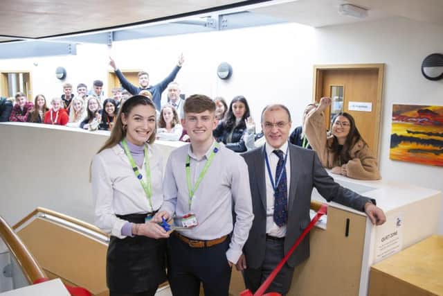 Head girl Emma Peel and head boy Hughie Johns pictured cutting the ribbon with head teacher David James. Picture: Kirsty Edmonds.