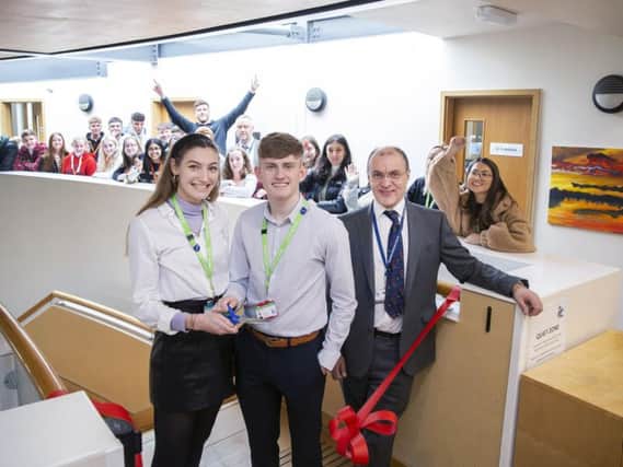 Head girl Emma Peel and head boy Hughie Johns pictured cutting the ribbon with head teacher David James. Picture: Kirsty Edmonds.