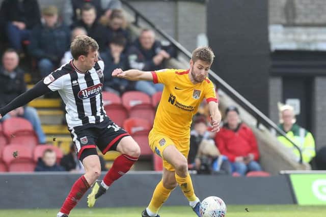 Sam Foley on the ball during Saturday's game at Blundell Park. Pictures: Pete Norton