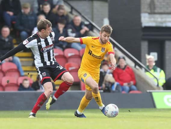 Sam Foley on the ball during Saturday's game at Blundell Park. Pictures: Pete Norton
