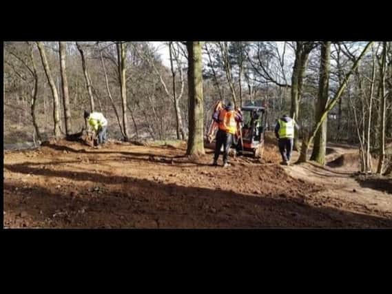 Council workers flatten the ramps in Cherry Orchard Woods
