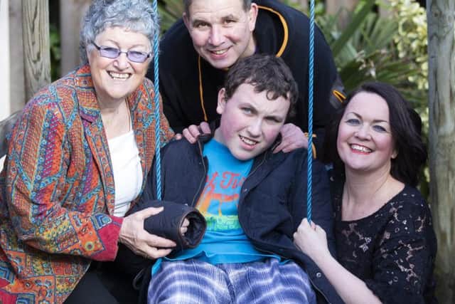 Julie Young (right) wants to know why her son Lloyd (centre) cannot access a medical cannabis prescription.