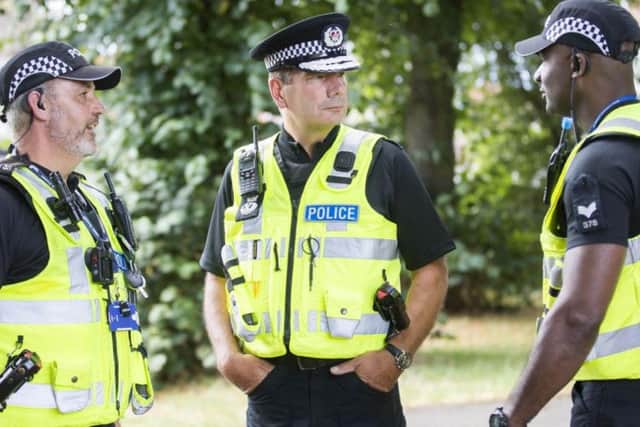 Nick Adderley (centre) says officers can still respond to incidents during meal breaks