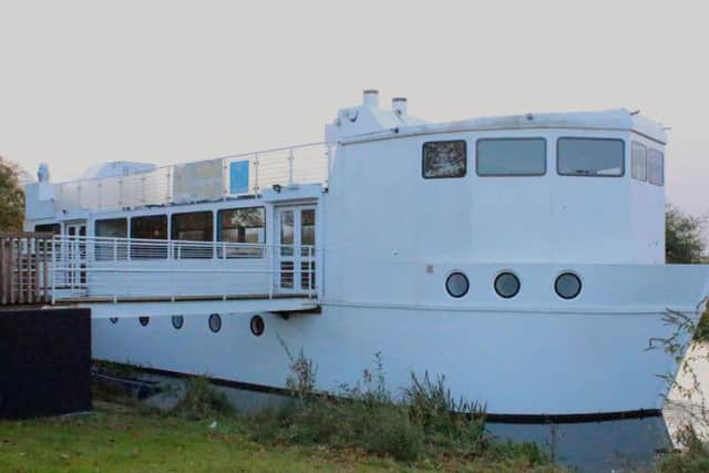 floating boat cafe The Ark is moored off Midsomer Meadows.