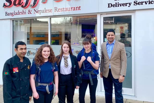 The fund-raising trio pictured outside Saffron